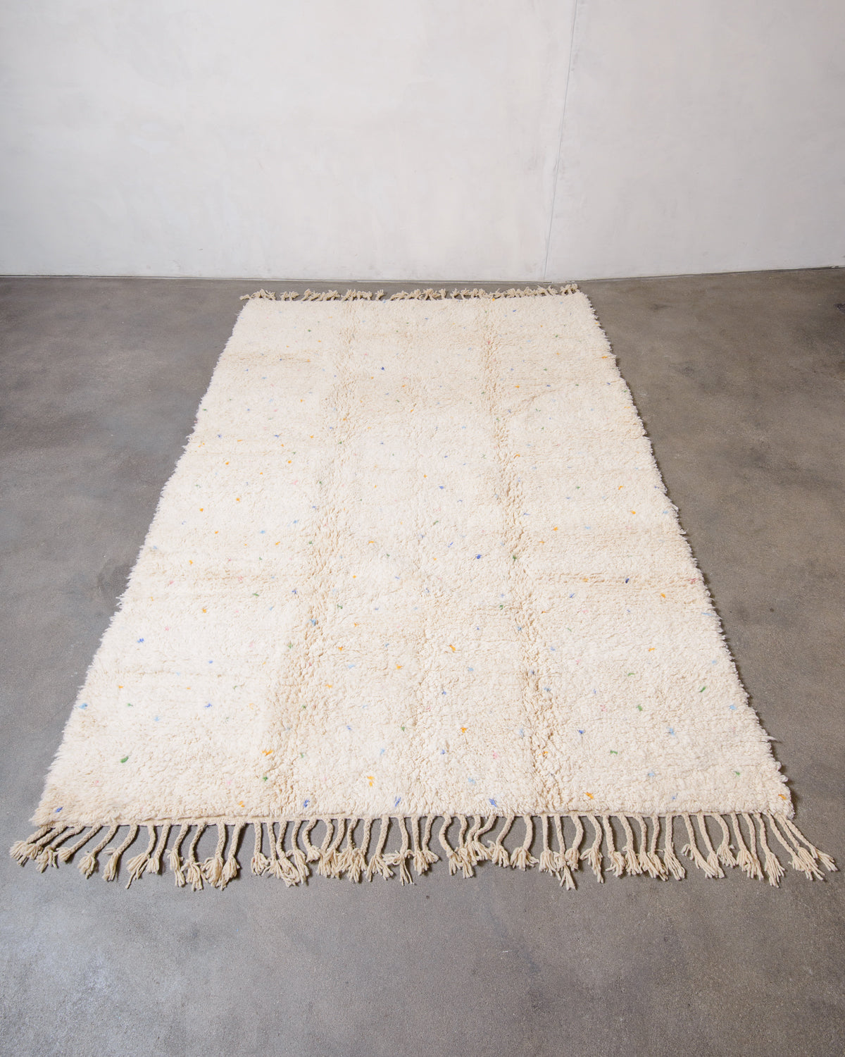 Modern, designer, handcrafted Berber rug from Morocco. Beniourain carpet with minimalist design, natural wool pile and a fluffy texture.